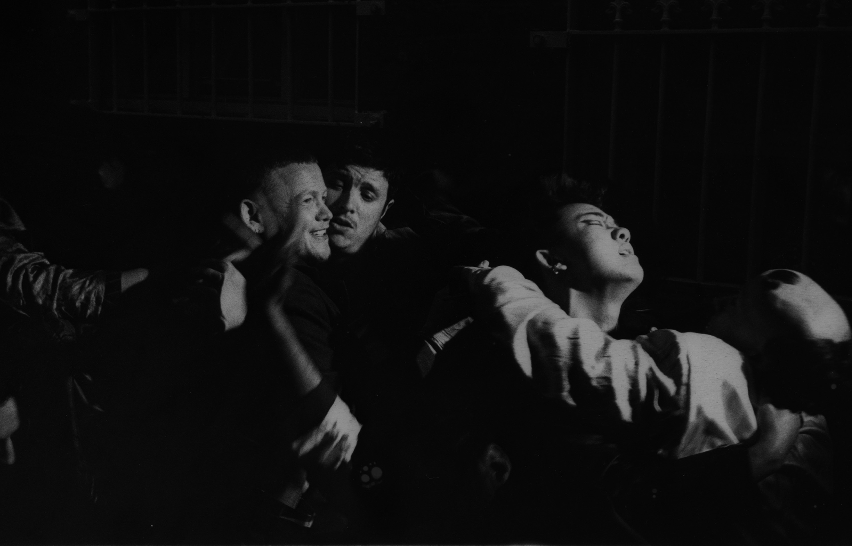black and white photo of a group of people, including Kae Tempest